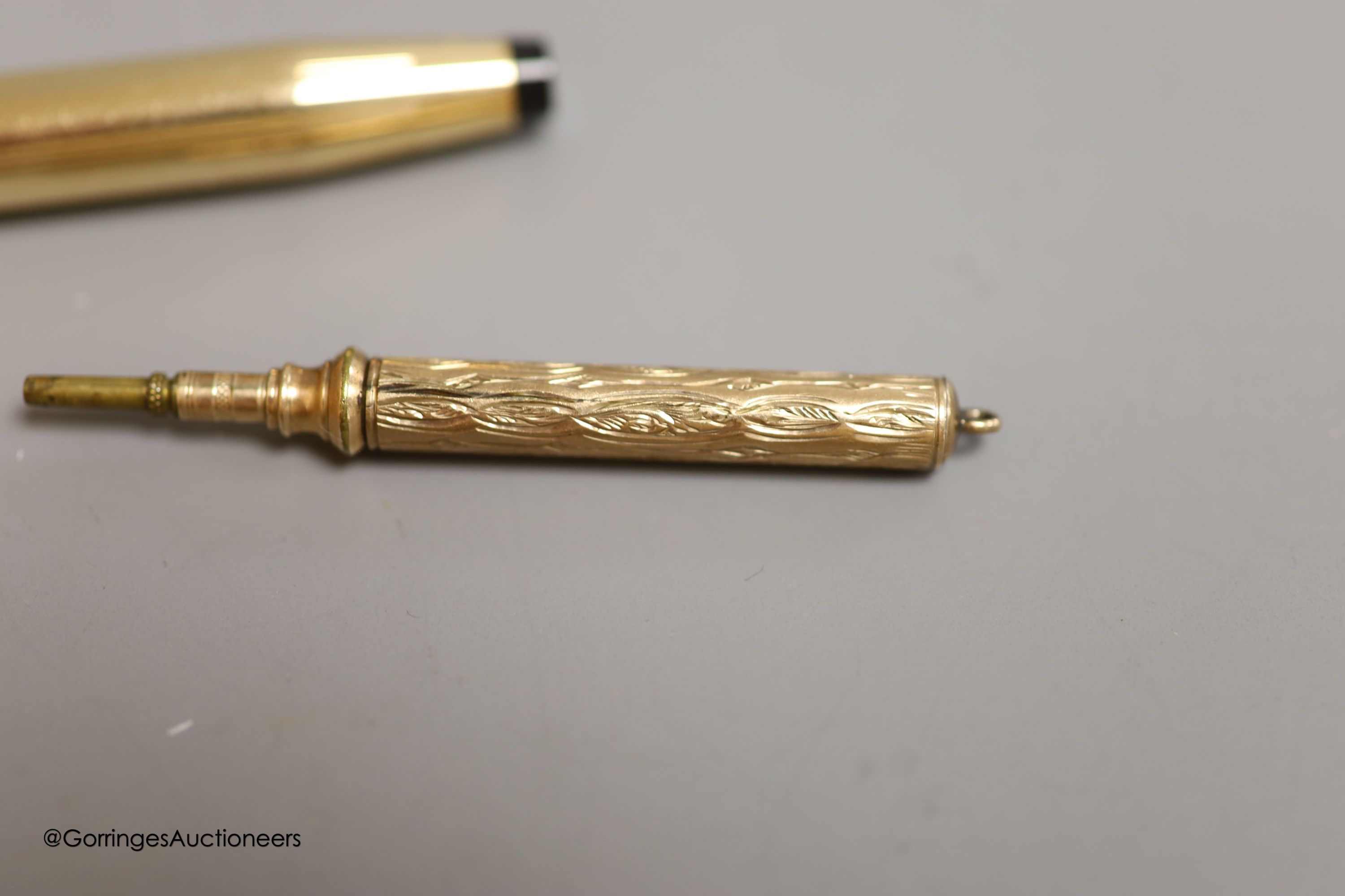 Rolled gold pens and pencils including a T-bar and two silver cased pencils.